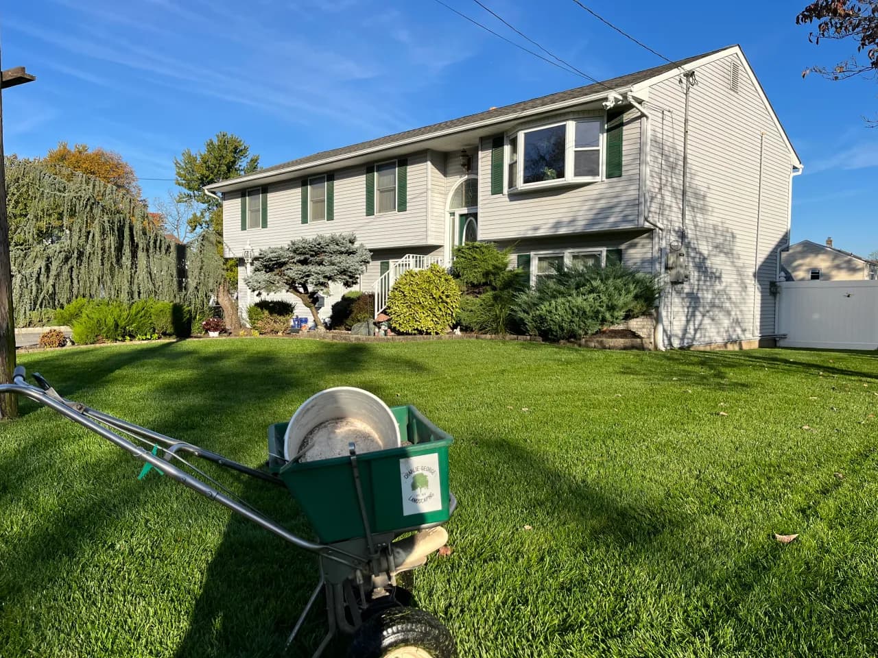 Lawn fertilizing at a split-level home